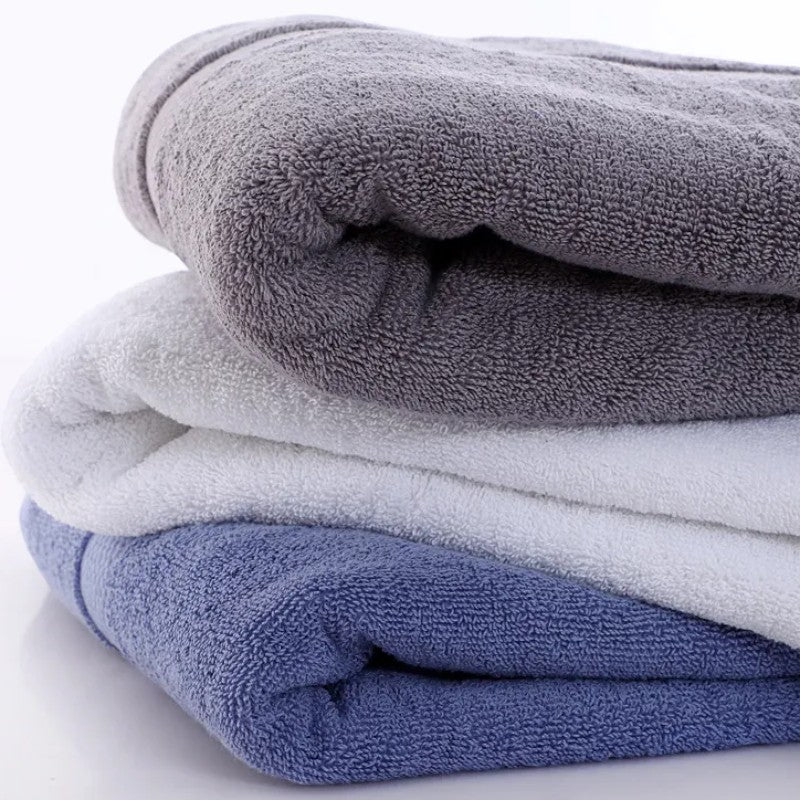 Stack of three cotton bath towels viewed from above — Holm & Hearth