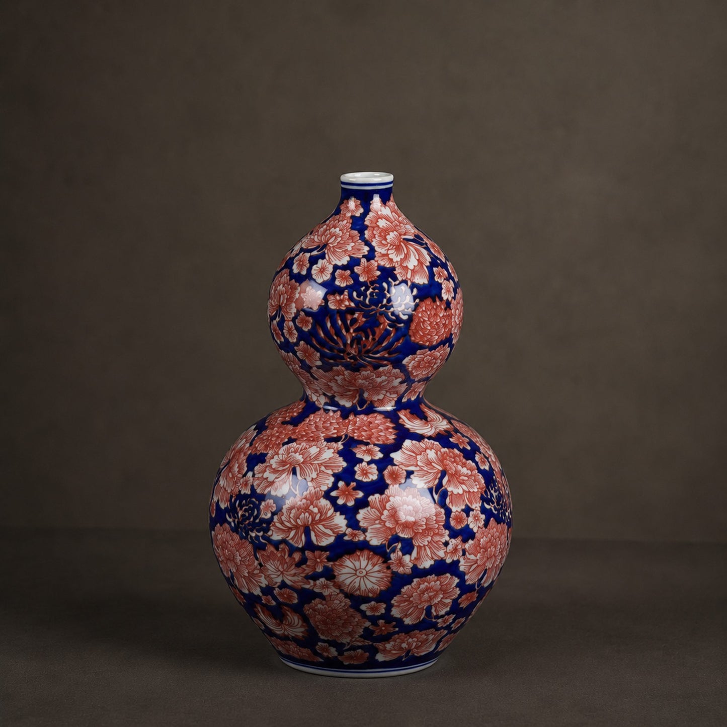 Cobalt aubergine porcelain gourd bottle vase catalogue shot on warm grey background