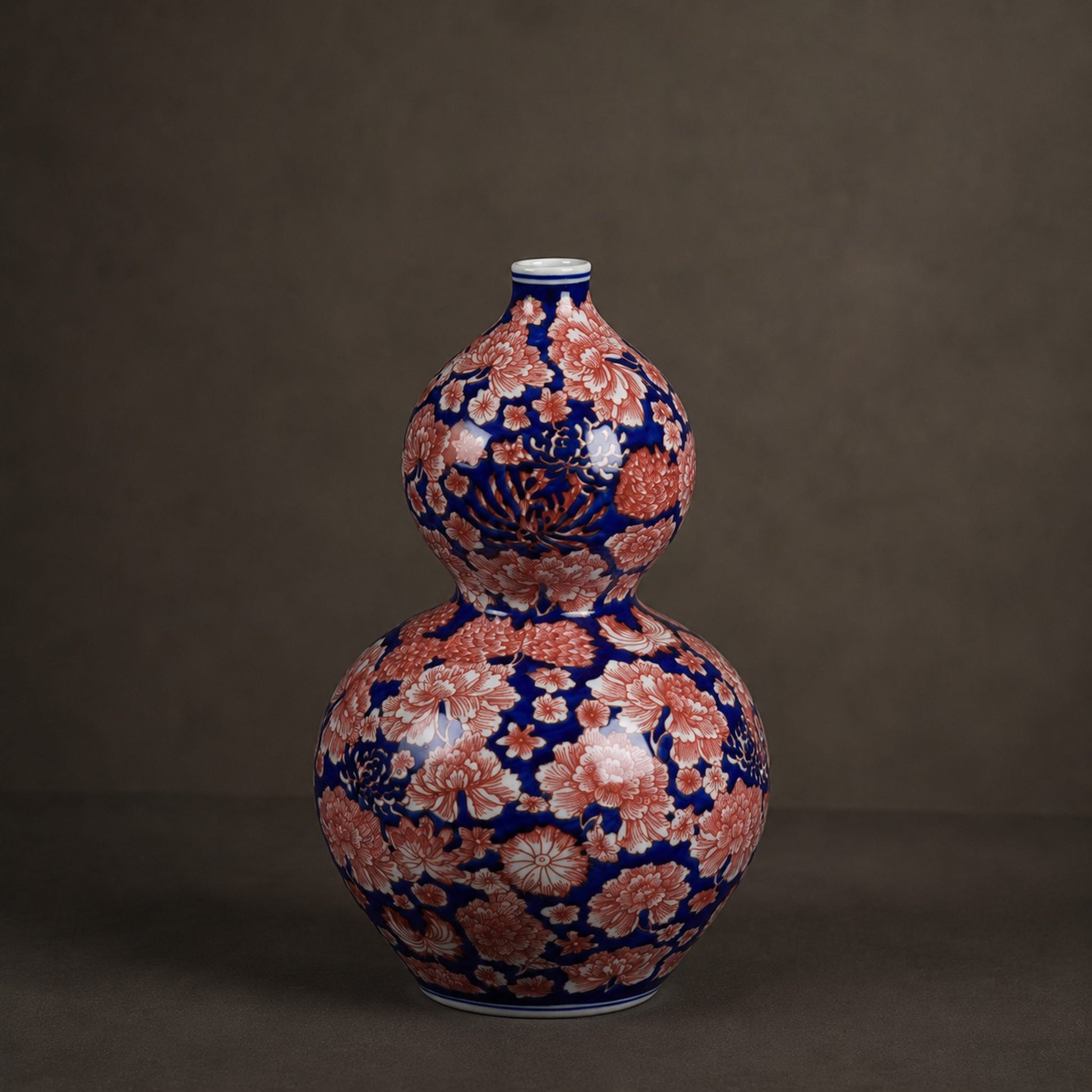 Cobalt aubergine porcelain gourd bottle vase catalogue shot on warm grey background