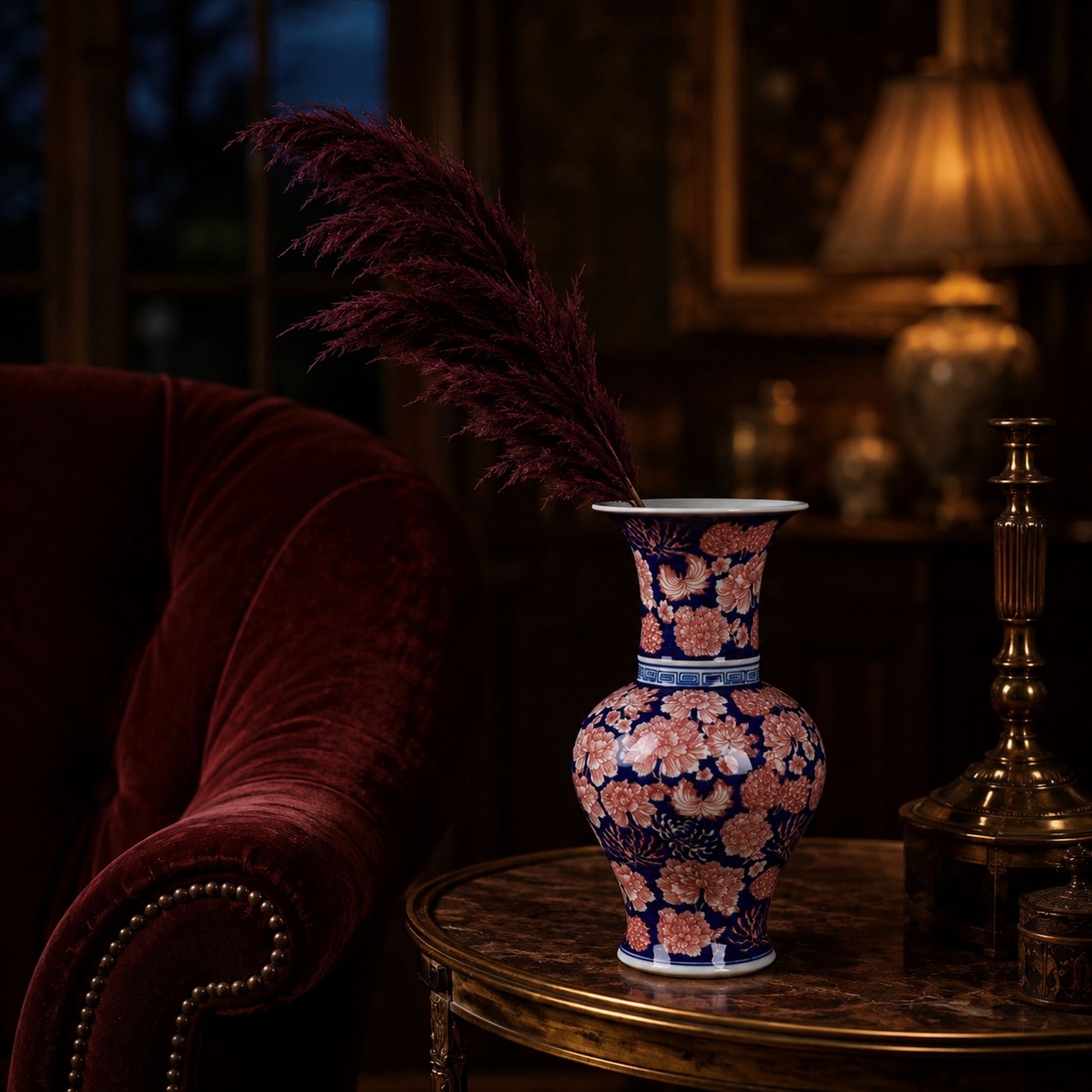 Cobalt aubergine porcelain mushroom bottle vase styled on side table with pampas grass