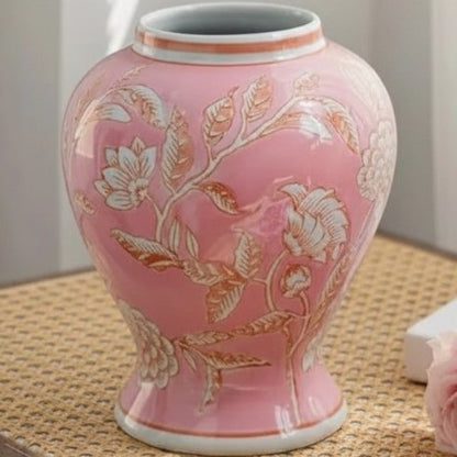 Pink pot-belly chinoiserie ceramic vase on a rattan surface — Holm & Hearth