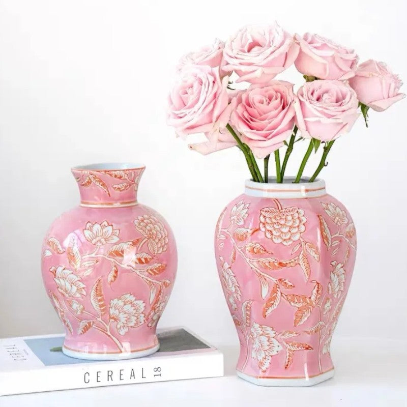 Pink hexagonal and carrot bottle ceramic vases with roses on books — Holm & Hearth