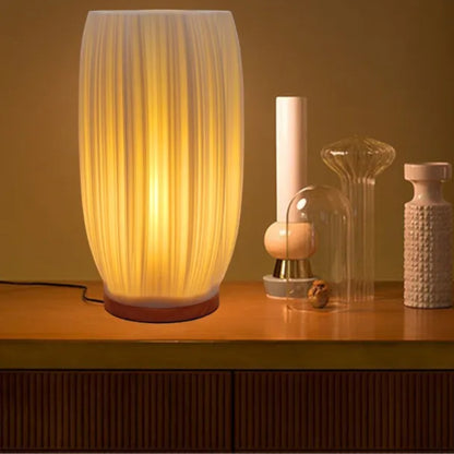 Column variant cordless lamp lit on a sideboard in a living room — Holm & Hearth