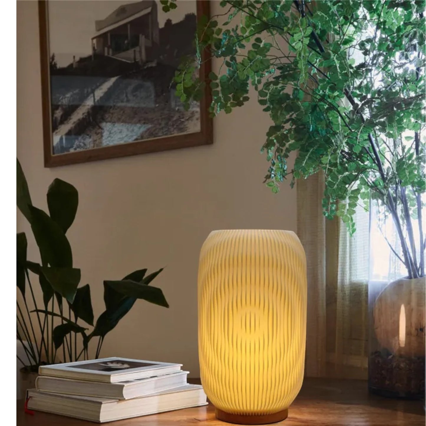 Pleat cordless table lamp glowing warmly on a living room side table — Holm & Hearth