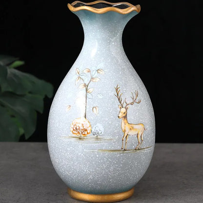 Pale ceramic vase with deer scene and scalloped gilt rim — Holm & Hearth