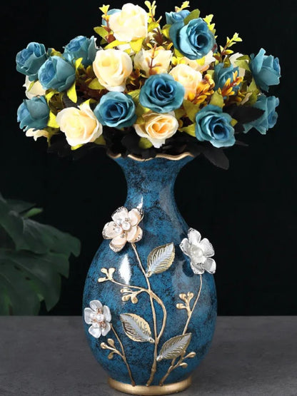 Teal ceramic vase with raised floral detail holding rose bouquet — Holm & Hearth
