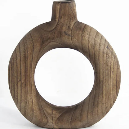 Round hand-carved wooden bud vase in light walnut on a clean background — Holm & Hearth