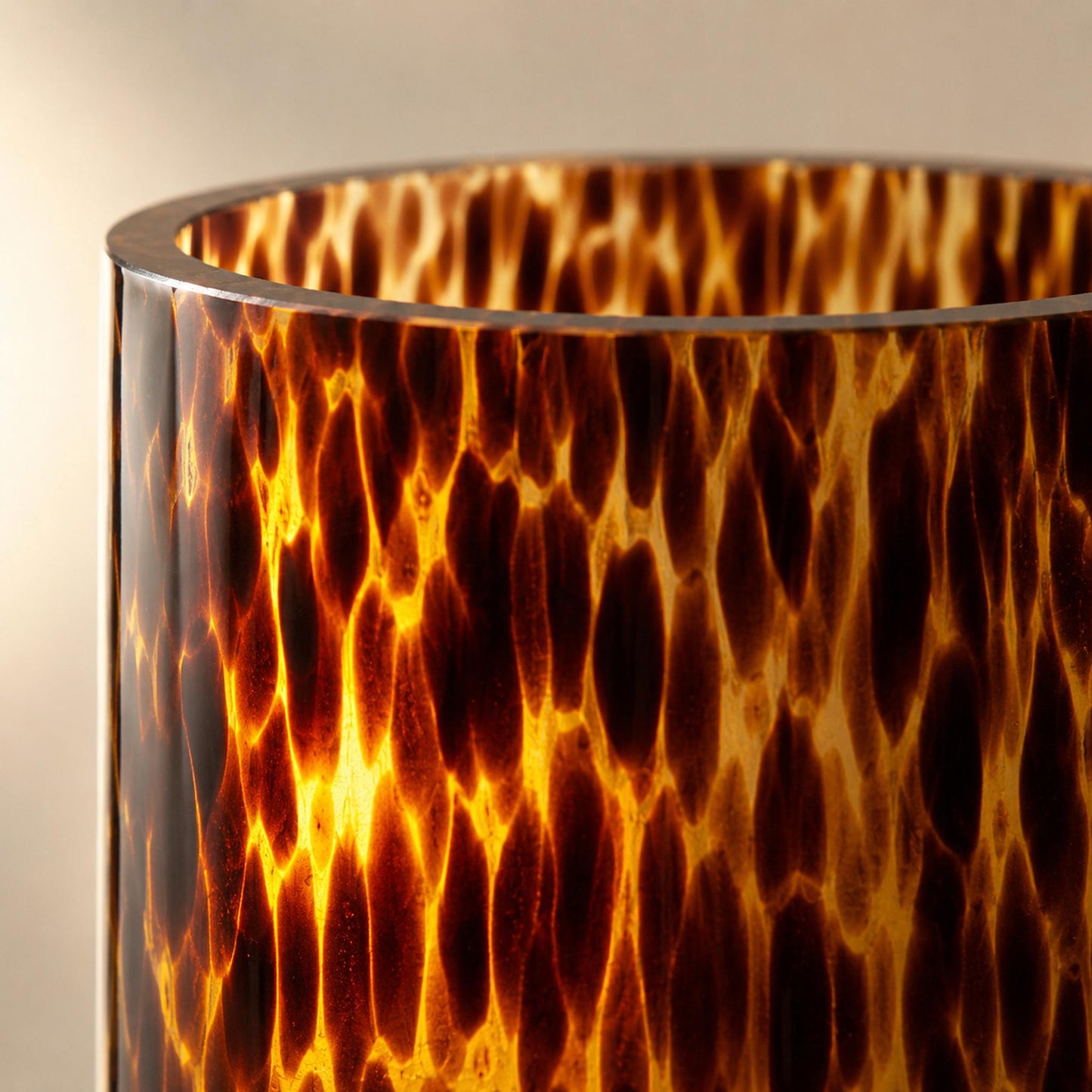 Leopard print glass vase pattern close-up detail with translucent backlit amber tortoiseshell