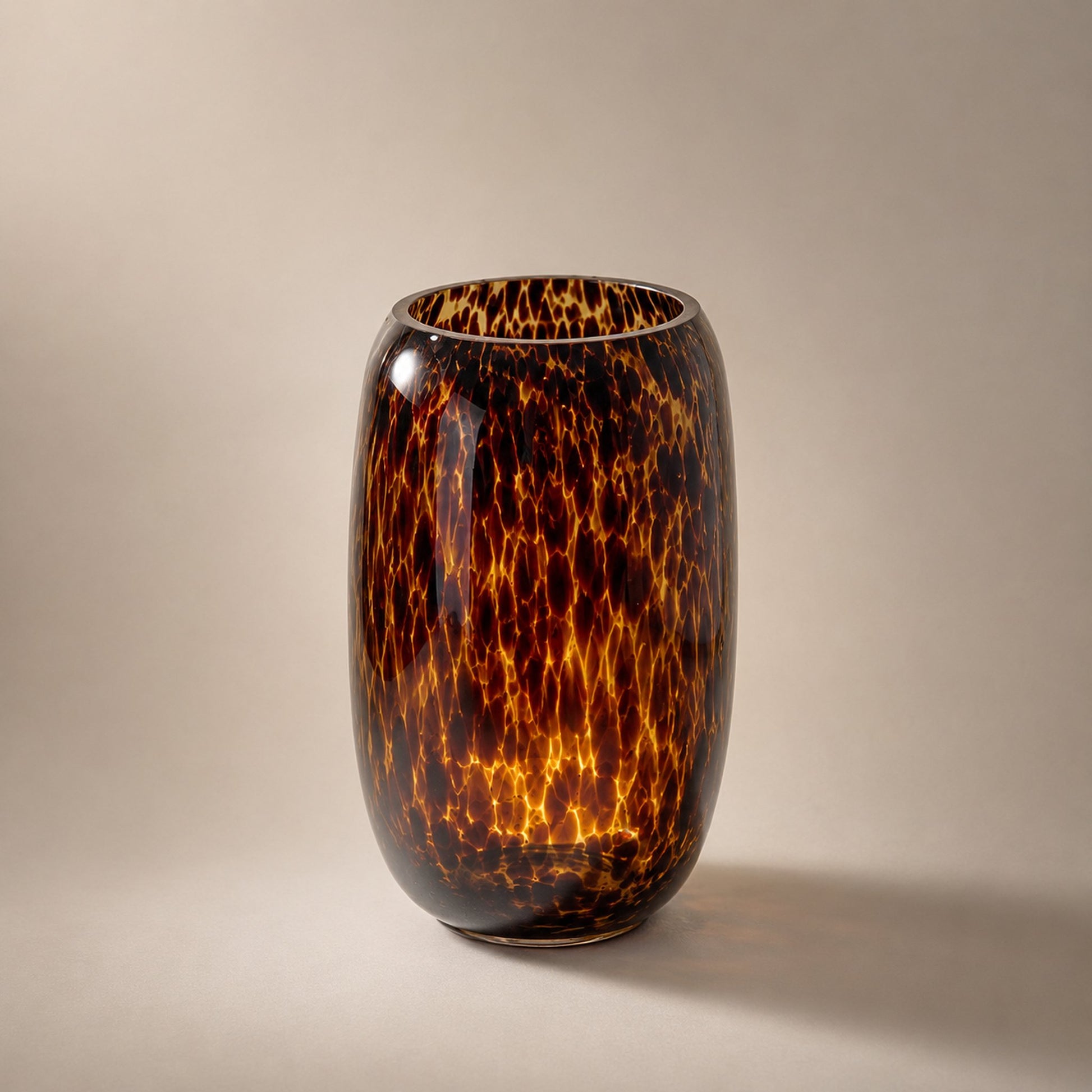 Leopard print glass footed urn vase catalogue shot in warm amber tortoiseshell